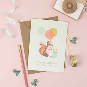 Squirrel with colourful balloons birthday card for children.