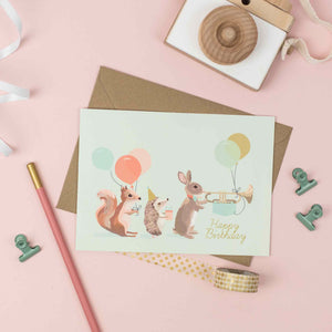 Woodland Animal Parade showing a squirrel, rabbit and hedgehog Happy Birthday Card
